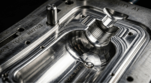 Precision steel injection mold tooling for custom health supplement packaging, illustrating upfront capital expenditure.